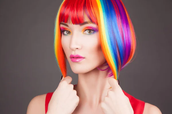 Beautiful woman wearing colorful wig — Stock Photo, Image