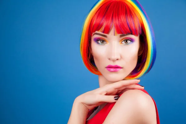 Beautiful woman wearing colorful wig — Stock Photo, Image