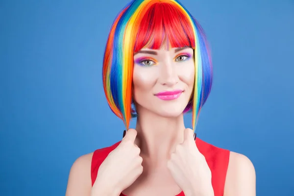 Beautiful woman wearing colorful wig — Stock Photo, Image