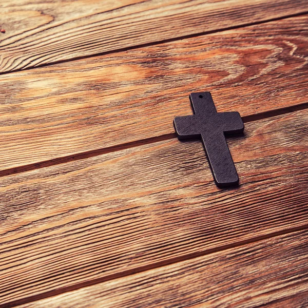 Old cross on a brown wood — Stock Photo, Image