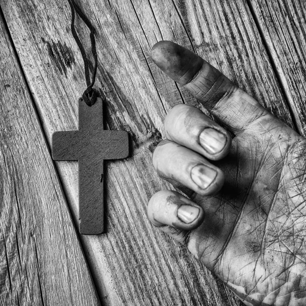 Cross in hand on  background — Stock Photo, Image