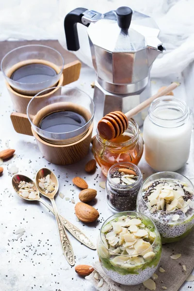 Healthy breakfast chia seed pudding almond milk fruit honey coffee — Stock Photo, Image