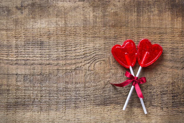 Candy lollipop pro Valentýn ve tvaru srdce — Stock fotografie