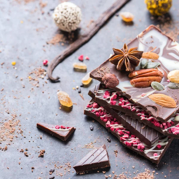 Stack of chocolate bars and praline truffle — Stock Photo, Image