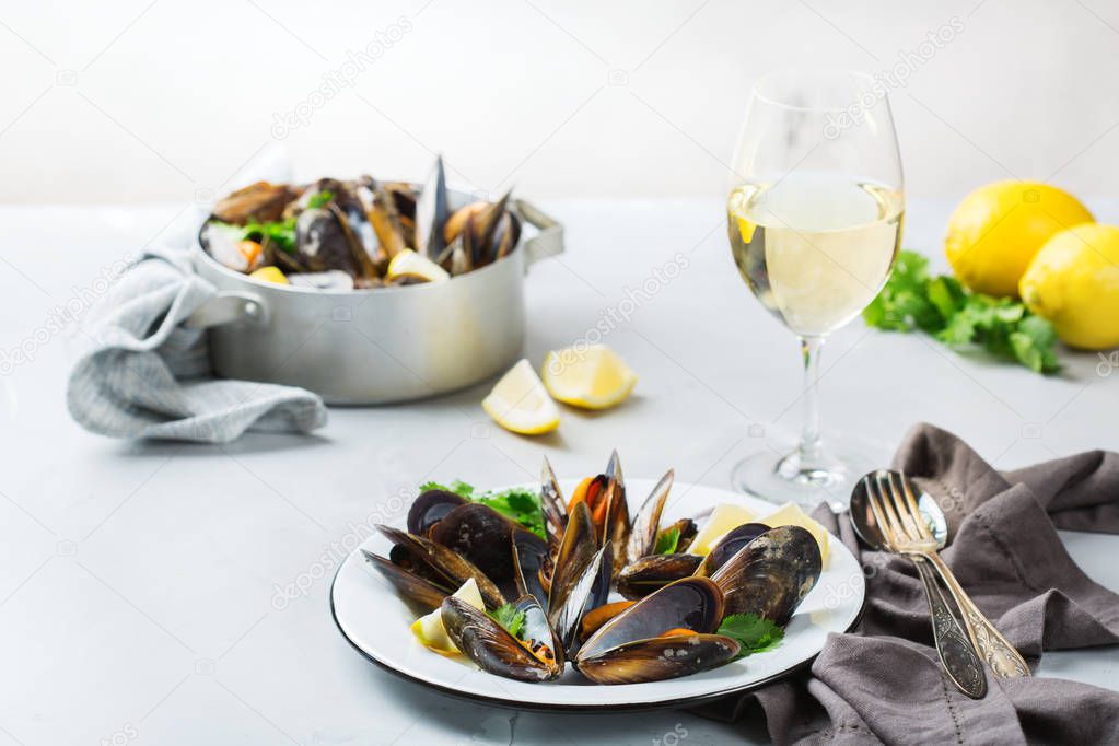 Shellfish mussels with white wine, seafood on a table