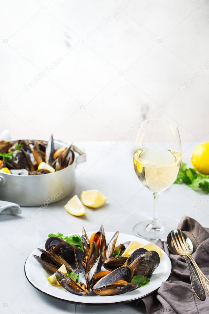 Shellfish mussels with white wine, seafood on a table