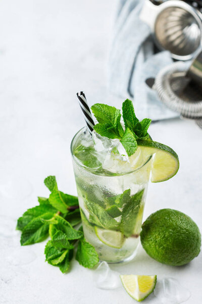 Classic alcohol cocktail mojito with rum, soda, lime and mint