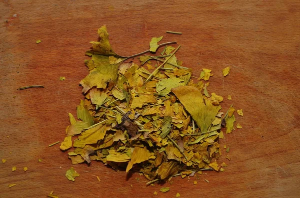 Dried ginkgo leaves on the table.