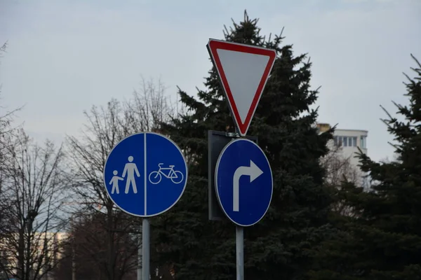 Shivering signs: turn right, footpath. Organization of traffic on the roads using signs.