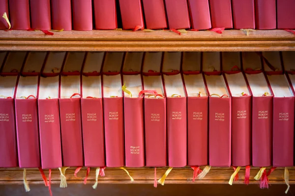 Stack of red bible books in church. Sweden, Europe — Stock Photo, Image