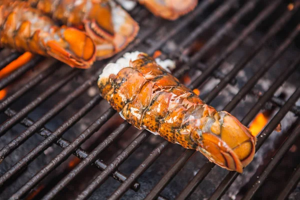 Grilled giant lobsters. Lobster bbq, no claws. Street food.