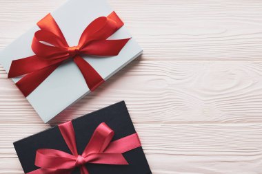 Top view two gift boxes on a white wooden background with copy space