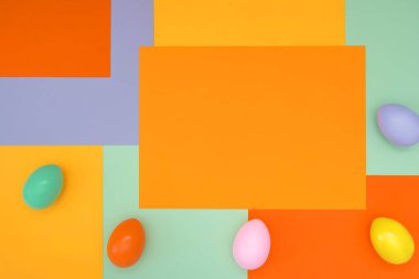 Paskalya yumurtalarının kompozisyonu ve modaya uygun renklerde simetrik olmayan parlak bir arka plan. Kavram geçmişi, tatil, paskalya, çocukların yaratıcılığı