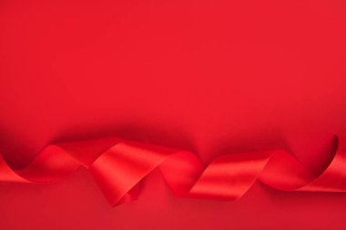 Curly red ribbon background