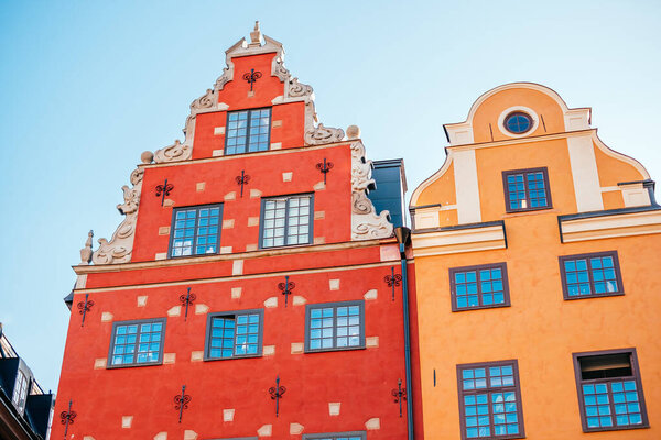 Stockholm, Sweden - June 29, 2019: Colorful facade of the houses in Stortorget square in Stockholm old town center also known as Gamla Stan.