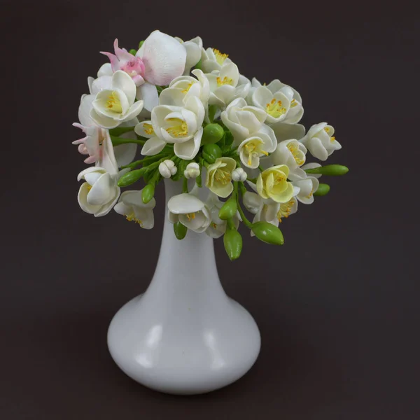 Hand made polymer clay flower bouquet in a white vase on a dark — Stock Photo, Image