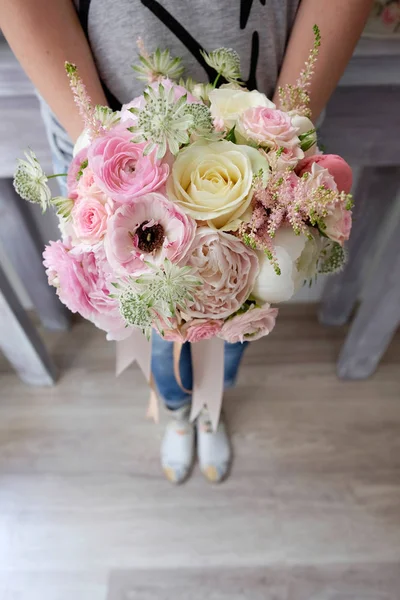 Pink bridal bouquet. Top view over a beautiful bridal flowers bouquet for wedding event.