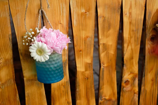 Floral design for special events. Beautiful flower arrangement design for special events on wooden fence background.