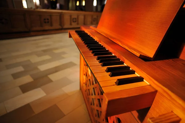 Upright piano inside the church. Upright piano inside of St Elisabeth catholic church from city of Darmstadt, Germany.