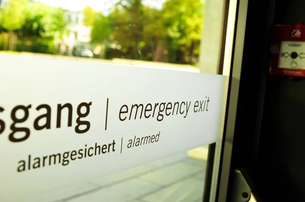 Emergency exit door. Glass door for emergency exit in case of fire from office building.