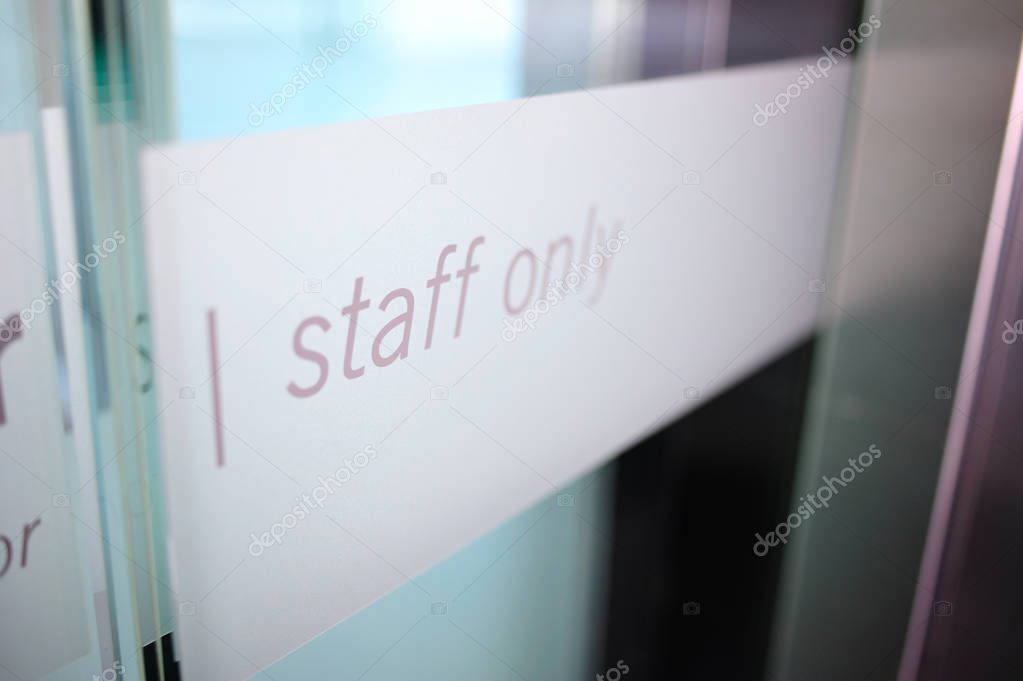 Staff only restricted area. Staff only sign on a private room door inside office building only for staff members.