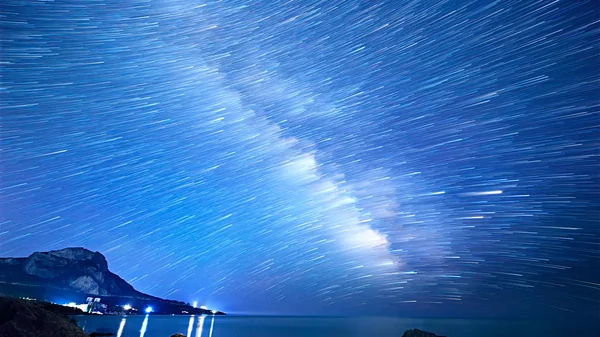 Star tracks over the sea. Time Lapse