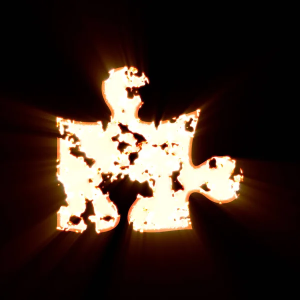 Symbol kawałek puzzle spalony na czarnym tle. Jasny blask — Zdjęcie stockowe
