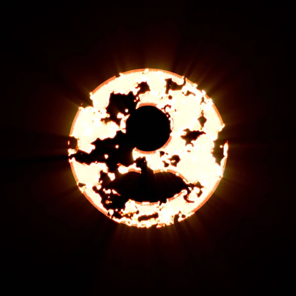 Символ пользователя круг сгорел на черном фоне. Яркий свет — стоковое фото