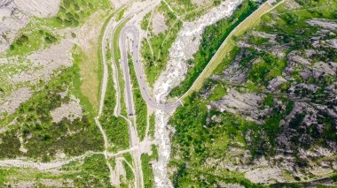 Switzerland. Picturesque winding mountain road with tunnels Gotthardstrasse, Aerial View, HEAD OVER SHOT 