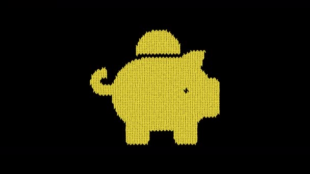 Das symbolische Sparschwein ist aus einem Wollfaden gestrickt. Stricken wie ein Pullover — Stockvideo