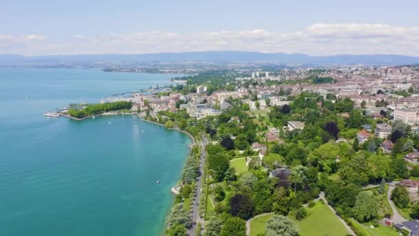 Lausanne, Switzerland. Flight over the central part of the city. The coast of Lake Geneva. 4K — Stock Video