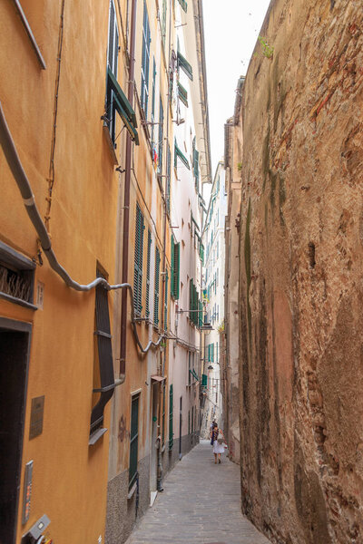 Genoa, Italy - July 11, 2019: Labyrinths of narrow streets and alleys of the old city - Caruggi di Genova