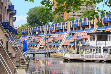 Rotterdam, Netherlands - July 1, 2019: Houses with terraces on the Haagseveer canal
