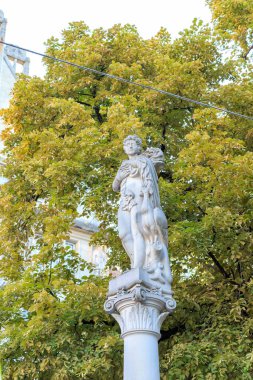 Zurich, Switzerland - July 6, 2019: Marble statue of a woman in a city park