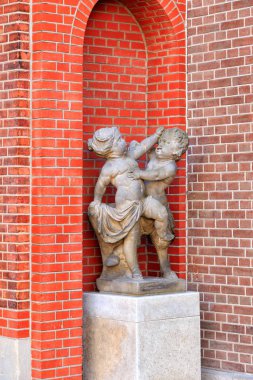 Amsterdam, Netherlands - June 30, 2019: Jan Peter van Bourschait the Elder, a group of two children: love and hate, circa 1720-30. Rijksmuseum park with free access