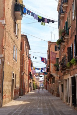 Venice, Italy - July 16, 2019: Residential Venice. Lingerie to dry on the clothesline. Seco Marina Street