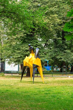 Krakow, Poland - July 21, 2019: Sculpture of the sculptor Pawel Orlowski in Planty Krakowski Park