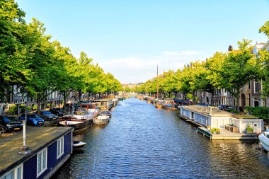 Amsterdam, Netherlands - June 30, 2019: Residential barges and h