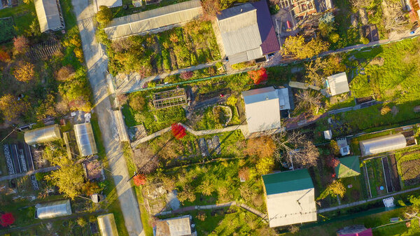Holiday village in the suburbs of the city of Ekaterinburg. Ural, Russia. Autumn, sunset time, Aerial View, HEAD OVER SHOT