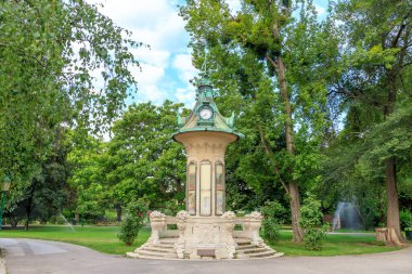 Vienna, Austria - July 20, 2019: Wetterhauschen - A metheorological column built 1913 in the Stadtpark in the 1st district of Vienna