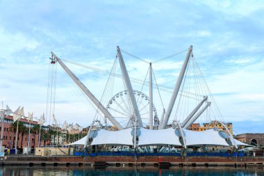 Genoa, Italy - July 11, 2019: Simulation of the arrows of port cranes! At the pier in the Old Port there is an unusual-looking attraction Il Bigo