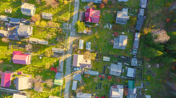 Holiday village in the suburbs of the city of Ekaterinburg. Ural, Russia. Autumn, sunset time, Aerial View, HEAD OVER SHOT