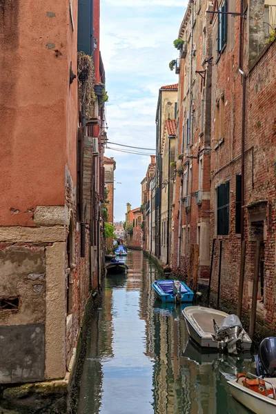 Venice, Italy. Boats moored in a narrow canal rio di Toresele