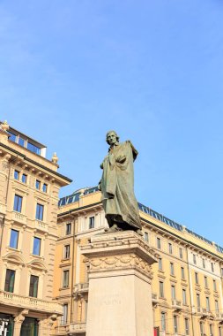 Milan, Italy - July 7, 2019: Monument to the Italian poet Giuseppe Parini, Piazza Cordusio. Sculptor Luigi Secchi (1853-1921), architect Luca Beltrami (1854-1933)