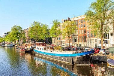 Amsterdam, Netherlands - June 30, 2019: Residential barges and h