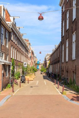 Amsterdam, Netherlands - June 30, 2019: The historic city center of Amsterdam in the morning. Eerste Weteringdwarsstraat
