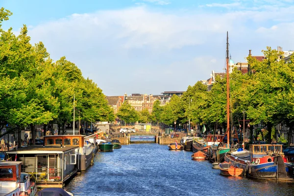 Amsterdam, Netherlands - June 30, 2019: Residential barges and h