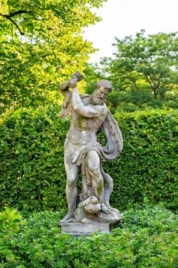 Amsterdam, Netherlands - June 30, 2019: Antique marble statues in the Rijksmuseum park with free access.