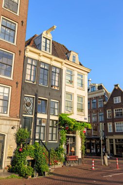 Amsterdam, Netherlands - June 30, 2019: Canal (street) Amstel intersection with Amstelstraat. The historic city center