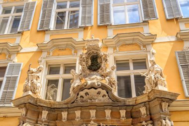 Graz, Austria - July 19, 2019: House with a bas-relief over the door. Portrait of Charles II (Archduke of Austria). Burgergasse Street